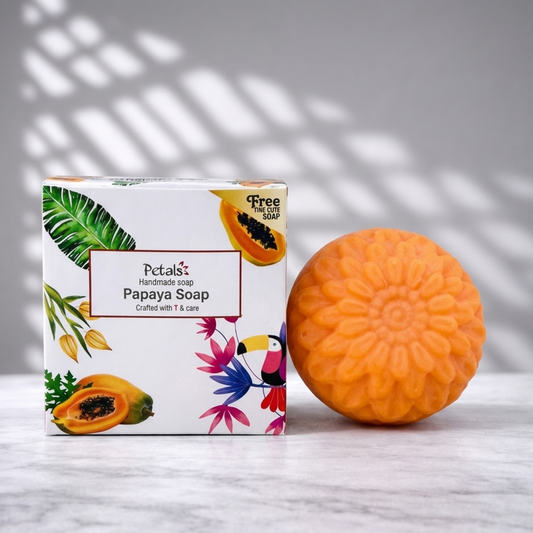 Papaya soap with packaging on a light background