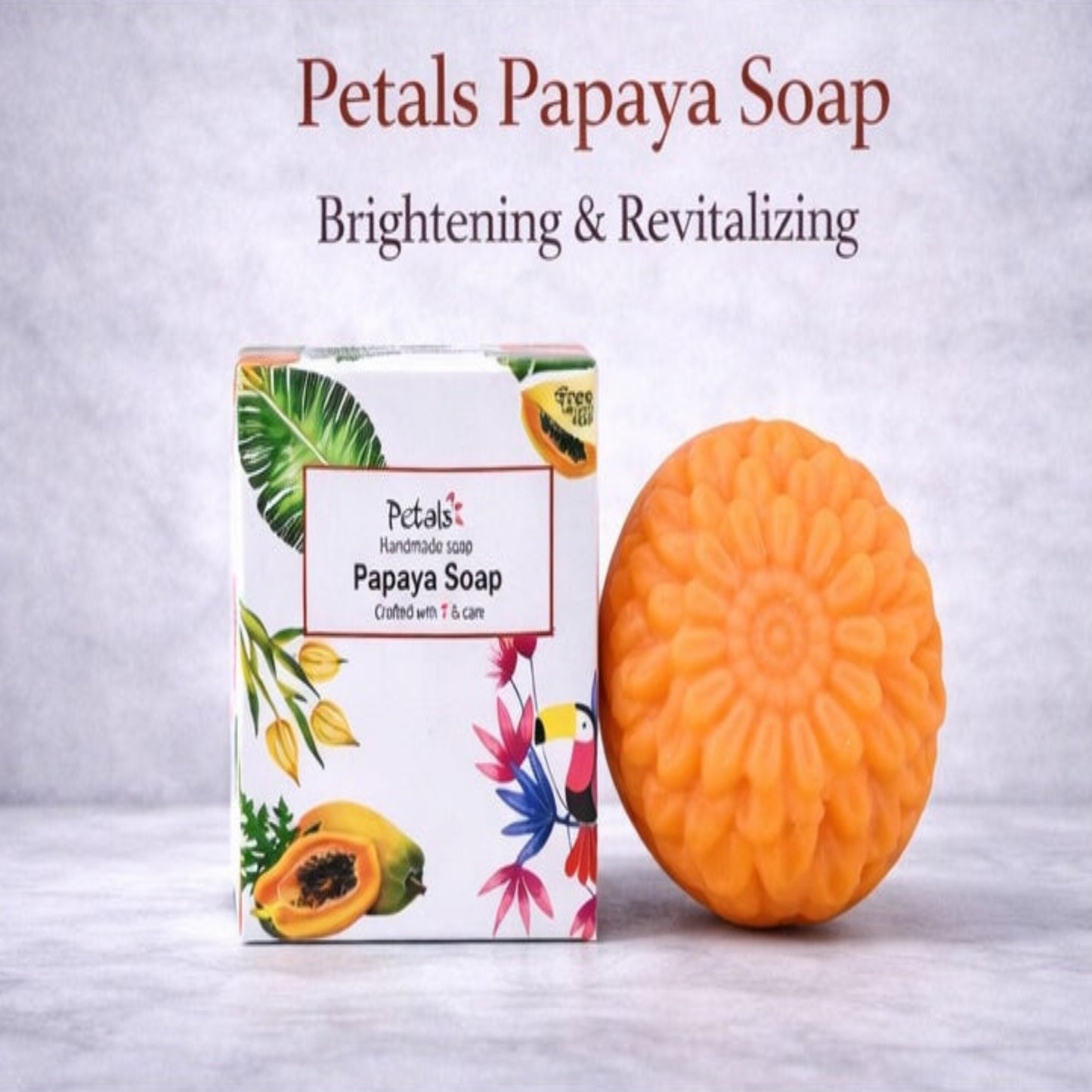 Petals Papaya Soap with packaging on a light gray background