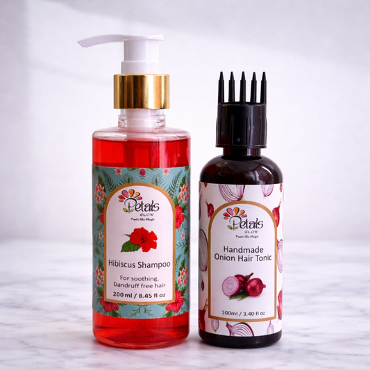 Two bottles of Petals hair care products on a white background